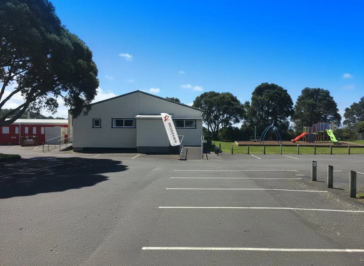 The Onuku-Taipari Domain Hall, with a playground and car park alongside.