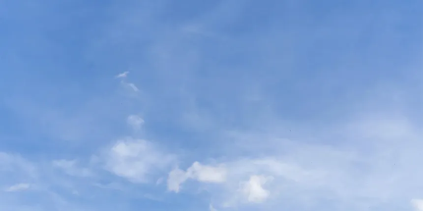 Blue sky with scattered white clouds.